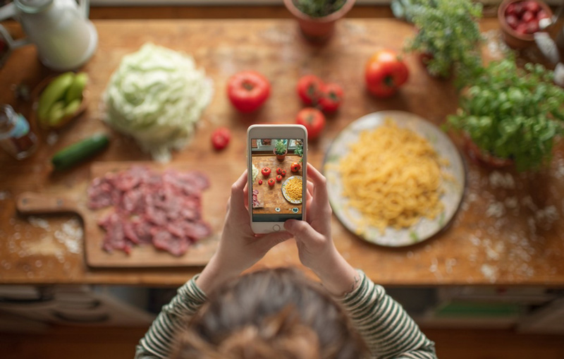 Taking photo of ingredients on kitchen counter
